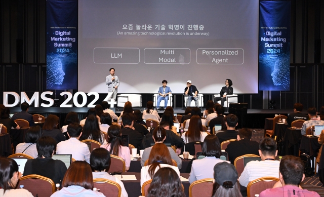 DMK Global CEO Park Se-jeong, Unboundlab CEO Cho Yong-min, Sungshin Women’s University adjunct professor Lee Si-han, and Park Ki-young, head ofCreative Shop North East Asia at Meta, join a panel discussion at Digital Marketing Conference 2024, held at Coex, Seoul, Tuesday. (Lee Sang-sub/The Korea Herald)