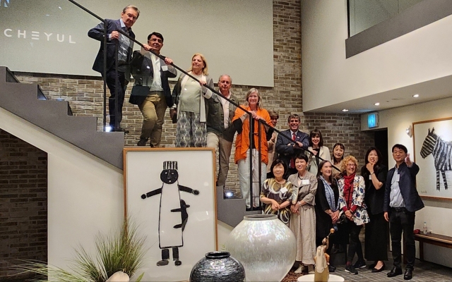 Guests pose for a photo after a tour at Cheyul’s flagship in Sinsa-dong, Seoul. (Choi Si-young/The Korea Herald)