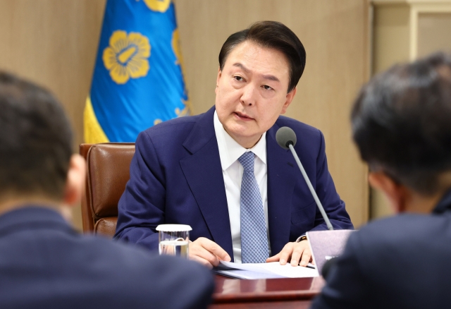 South Korean President Yonon Suk Yeol speaks at an interagency meeting on the economy at the presidential office in Seoul on Thursday. (Yonhap)