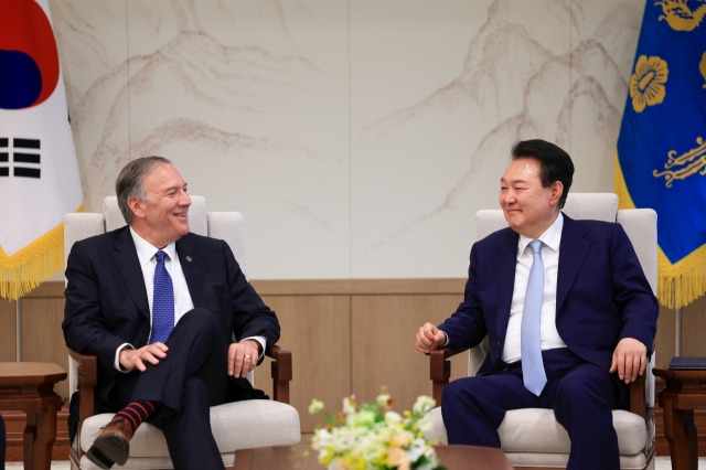 This photo released by the presidential office on Thursday shows President Yoon Suk Yeol (right) holding a meeting with former US Secretary of State Mike Pompeo in Seoul. (Yonhap)