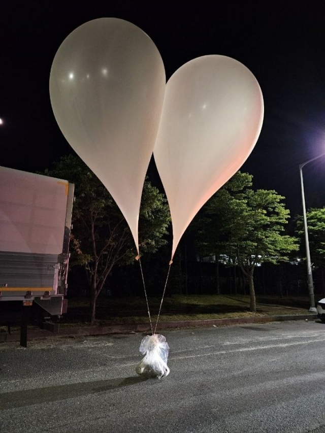 Balloons carrying waste and trash are found in Gyeryong City, South Chungcheong Province, Wednesday. (Yonhap)