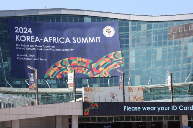 A banner of the 2024 Korea-Africa Summit is hung on the facade of the Kintex in Ilsan, north of Seoul, on Monday, on the eve of the summit. (Yonhap)