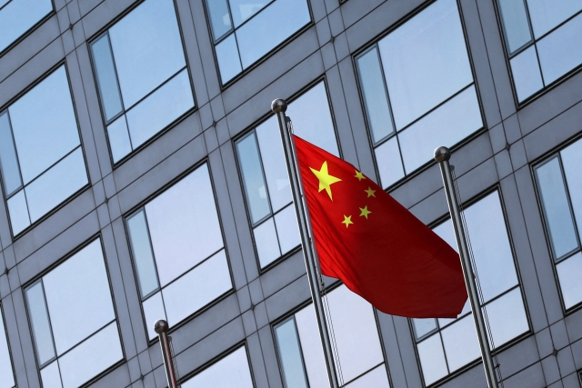 A Chinese flag flutters outside the China Securities Regulatory Commission (CSRC) building on the Financial Street in Beijing, China. (Reuters)