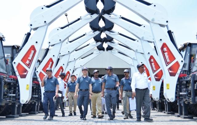 Doosan Bobcat'CEO and Vice Chairman Scott Park (fourth from left) and other company officials inspect the operational status of the Chennai plant in India on Tuesday. (Doosan Bobcat)