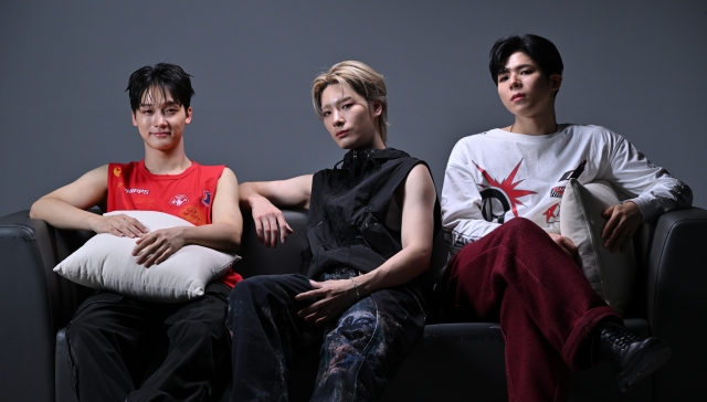 From left: Big Ocean members Hyunjin, Jiseok and Chanyeon pose for photos during an interview with The Korea Herald, Monday. (Im Se-jun/The Korea Herald)