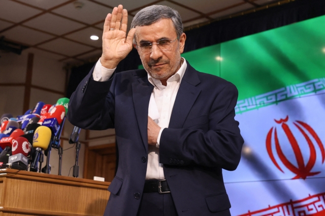 Iranian former president Mahmoud Ahmadinejad waves after registering his candidacy for Iran's upcoming presidential election in Tehran on June 2. (AFP)