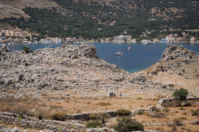 This photograph shows a view of the island of Symi as firefighters take part in a search and rescue operation for a missing British journalist, on Saturday. (AFP)