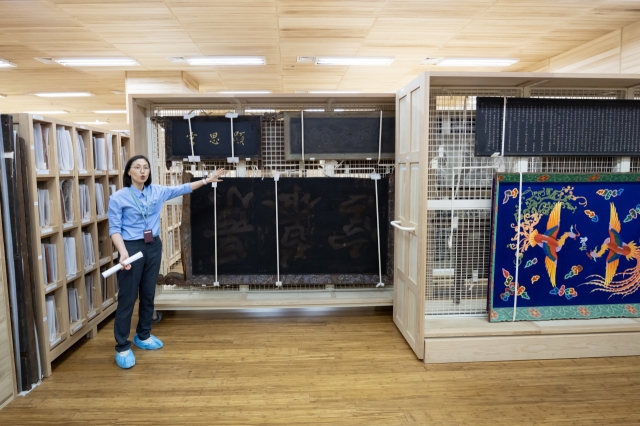 Jeong So-young, the director overseeing collection management at the National Palace Museum of Korea, briefs reporters during a tour of the museum storage facility in Seoul on Wednesday. (Yonhap)