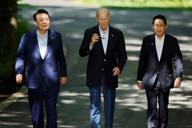 South Korean President Yoon Suk Yeol, US President Joe Biden and Japanese Prime Minister Fumio Kishida attend a joint press conference following a trilateral summit meeting at the Camp David presidential retreat in Maryland on Aug. 18, 2023. (Getty Images)