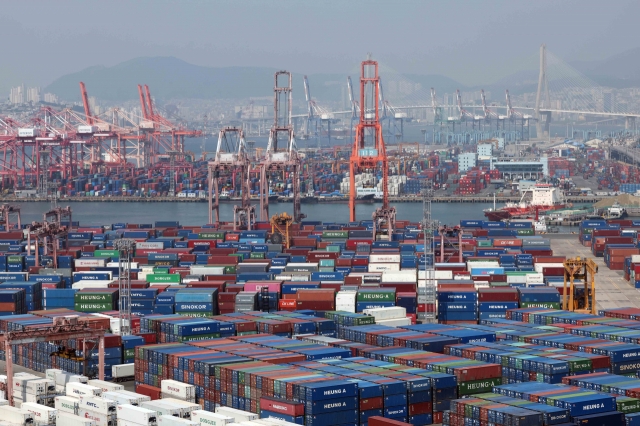 Shipping containers are stacked at a port in the southeastern city of Busan, June 11, 2024. (Newsis)