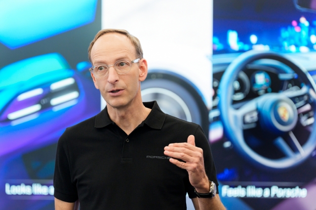 Holger Gerrmann, CEO of Porsche Korea, introduces the Macan Electric at the preview event on Monday. (Porsche Korea)