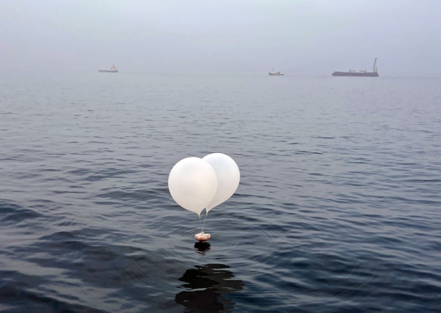 Balloons carrying garbage, presumably sent by North Korea, are seen floating on the Yellow Sea on Sunday. (Seven Stars cruise ship)