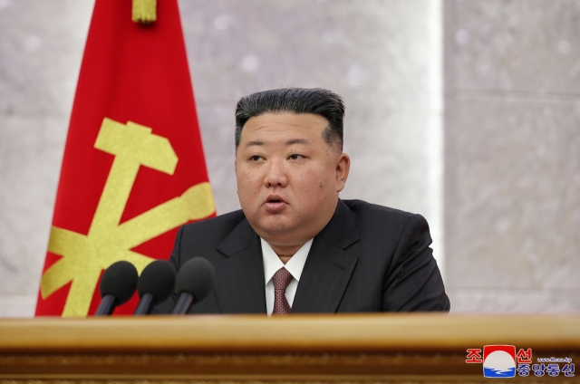 This photo, carried by North Korea's official Korean Central News Agency on Saturday, shows the North's leader Kim Jong-un presiding over a plenary meeting of the Central Committee of the ruling Workers' Party of Korea the previous day. (Yonhap)