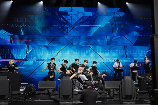 K-pop boy band Seventeen perform to their songs on the main Pyramid Stage at the Glastonbury Festival in Somerset, the United Kingdom, on Friday, local time. (Pledis Entertainment)