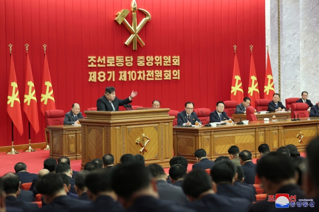 This photo, carried by North Korea's official Korean Central News Agency on Sunday, shows North Korean leader Kim Jong-un speaking at the 10th plenary meeting of the 8th Central Committee of the ruling Workers' Party of Korea the previous day. (Yonhap)