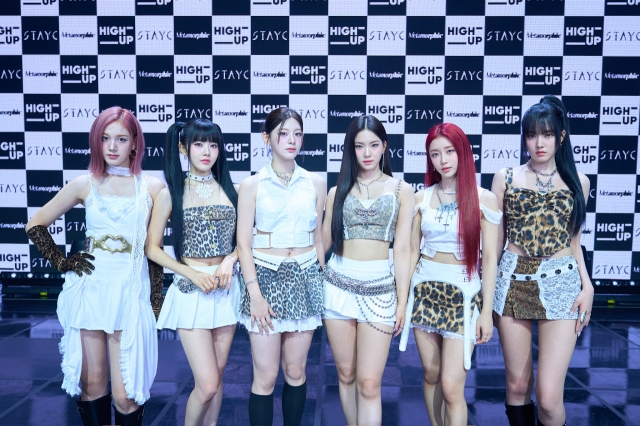 From left: StayC members J, Sieun, Seeun, Isa, Sumin, and Yoon pose for a picture during the press conference held at Gwangjin-gu, Seoul, Monday. (Highup Entertainment)