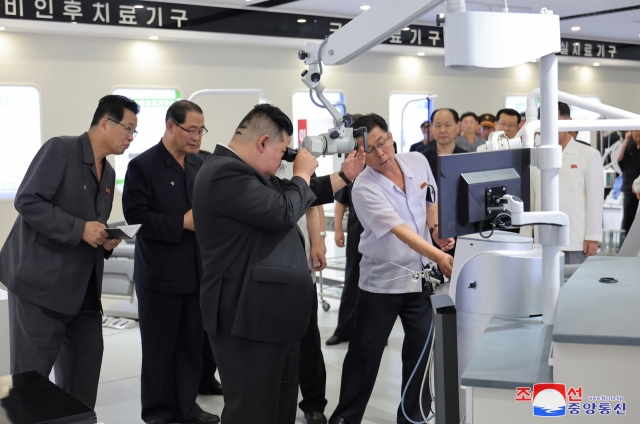 North Korean leader Kim Jong-un (center) inspecting a major defense industrial plant on Tuesday. The inspection took place right after the final day of a plenary meeting of the eighth Central Committee of the Workers' Party of Korea. (KCNA)