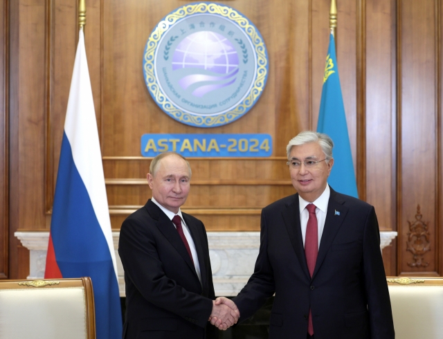 Russian President Vladimir Putin (left) and Kazakh President Kassym-Jomart Tokayev attend a meeting on the sidelines of the Shanghai Cooperation Organisation (SCO) summit in Astana, Kazakhstan, on Wednesday. The Shanghai SCO summit is taking place in Astana from Wednesday to Thursday. (Kremlin Pool via EPA)