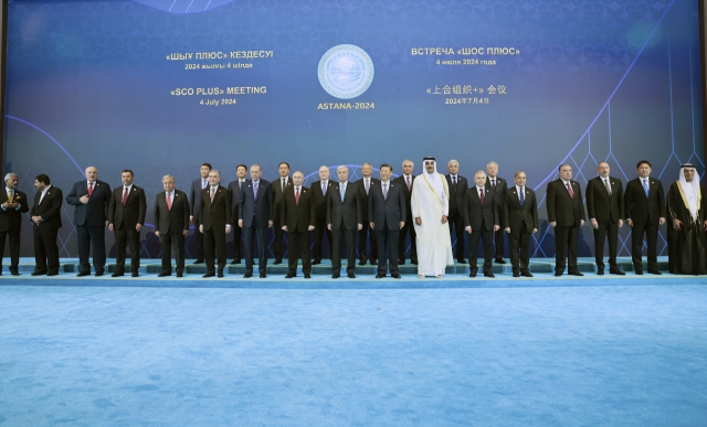 From left, Indian Foreign Minister Subrahmanyam Jaishankar, Iranian Interim President Mohammad Mokhber, Belarusian President Alexander Lukashenko, Kyrgyz President Sadyr Japarov, UN Secretary-General Antonio Guterres, Turkmen People's Council (Khalk Maslahaty) Chairman Gurbanguly Berdymukhamedov, Turkish President Recep Tayyip Erdogan, Russian President Vladimir Putin, Kazakh President Kassym-Jomart Tokayev, Chinese President Xi Jinping, Qatari Emir Sheikh Tamim bin Hamad Al Thani, Uzbek President Shavkat Mirziyoyev, Pakistani Prime Minister Shehbaz Sharif, Tajik President Emomali Rakhmon, Azerbaijani President Ilham Aliyev, Mongolian President Ukhnaagiin Khurelsukh and Sheikh Sultan bin Ahmed Al Qasimi, Deputy Ruler of Sharjah and Chairman of the Sharjah Media Council of the United Arab Emirates pose for a photo at the Shanghai Cooperation Organisation Plus summit in Astana, Kazakhstan, Thursday. (Kremlin Pool Photo via AP)