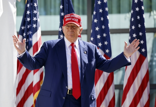 Former US President Donald Trump enters at a campaign event on June 18 in Wisconsin. (Yonhap-AP)