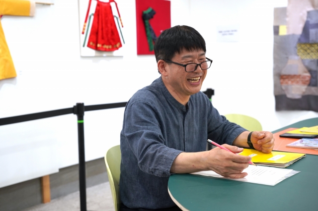 Dodo Cello Orchestra leader Kim Jae-uk speaks with The Korea Herald at Seoul Community Cultural Center Seogyo in Mapo-gu, western Seoul on June 15. (Lee Si-jin/The Korea Herald).