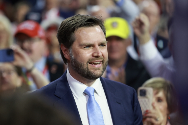 Trump's pick for Vice President, US Sen. J.D. Vance arrives on the first day of the Republican National Convention at the Fiserv Forum on Monday in Milwaukee, Wisconsin.