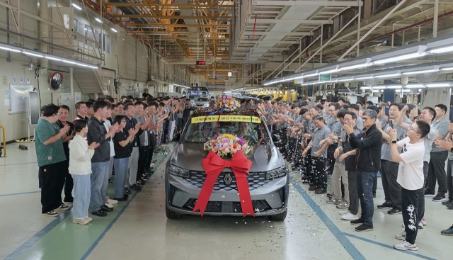 Renault Korea officials celebrate the rollout of the first unit of the new Grand Koleos at its Busan plant on Monday. (Renault Korea)