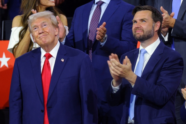 Republican presidential candidate former President Donald Trump and Republican vice presidential candidate Sen. JD Vance appear on the first day of the Republican National Convention at the Fiserv Forum in Milwaukee, Wisconsin, Monday. (AFP-Yonhap)