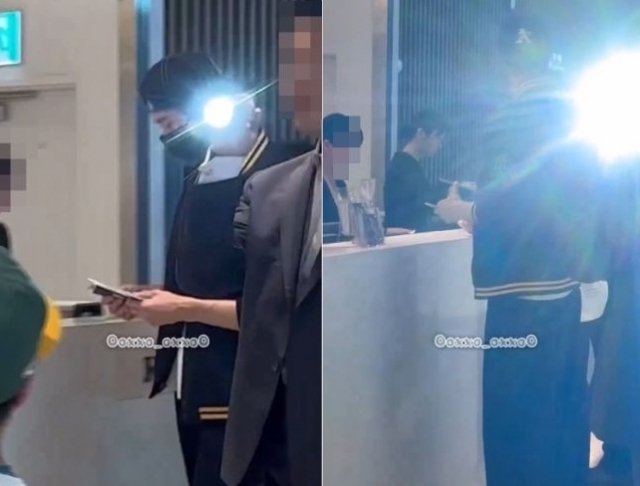 Photos posted online show Byeon Woo-seok's security personnel aiming a flashlight at a fan. (Screen capture from X)