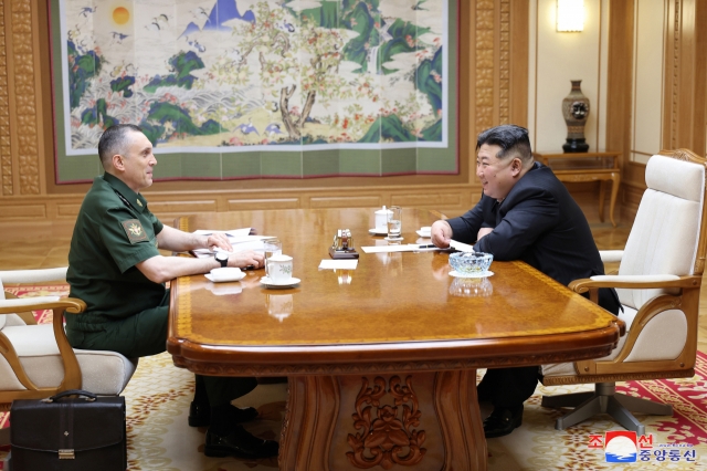 This photo, carried by North Korea's official Korean Central News Agency on June 19, 2024, shows the North's leader Kim Jong-un (right) meeting with Russian Vice Defense Minister Aleksey Krivoruchko in Pyongyang the previous day. (KCNA)