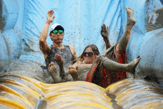 Visitors enjoy the mud slide at Boryeong Mud Festival (Boryeong Festival and Tourism Foundation)