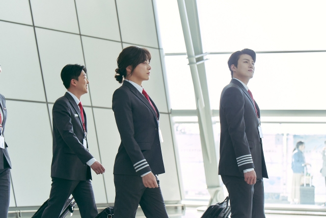 Jo Jung-suk (middle) stars as Jung-woo and Jang-mi in “Pilot.” (Lotte Entertainment)