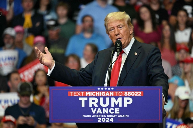 Former US President and 2024 presidential nominee Donald Trump speaks during a campaign rally at Van Andel Arena in Grand Rapids, Michigan, Saturday. (AFP-Yonhap)