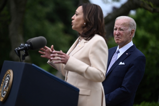 US President Joe Biden looks on as US Vice President Kamala Harris delivers remarks during National Small Business Week in the Rose Garden of the White House in Washington, DC, on May 1, 2023. (AP)