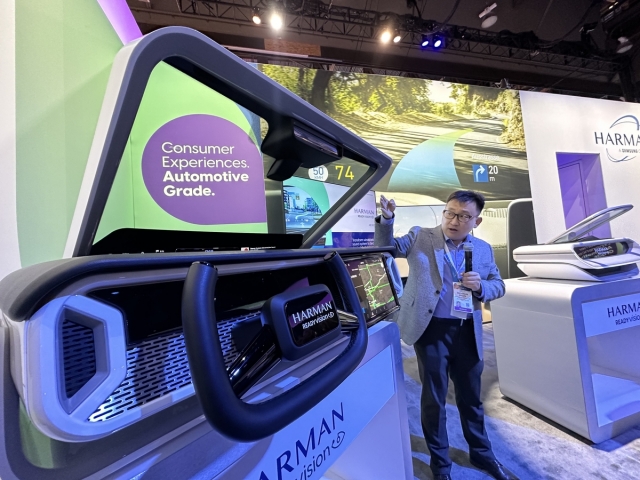 At CES 2024 in Las Vegas, a Samsung Electronics official introduces Harman Kardon's Ready Vision QVUE, an automotive augmented reality head-up display that turns the windshield into a seamless, high-quality display. (Samsung Electronics)