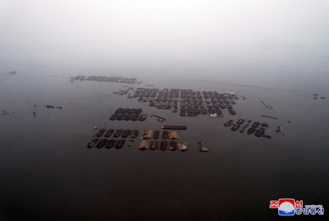 This photo, carried by North Korea's official Korean Central News Agency Wednesay, shows North Korea's border city of Sinuiju submerged due to the latest downpours. (Yonhap)