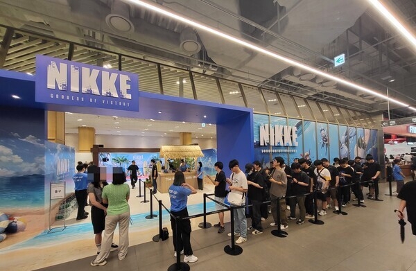 On July 27, a line of eager fans waited at The Hyundai Seoul department store in Yeouido to enter Shift Up’s pop-up store for the game “Goddess of Victory: Nikke.” (Newsis)