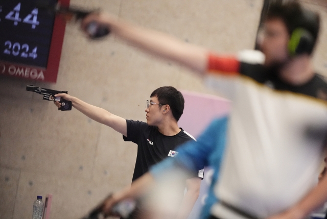 South Korea's Cho Yeong-jae competes in the 25m rapid fire pistol men's final at the 2024 Summer Olympics, Monday in Chateauroux, France. (AP)