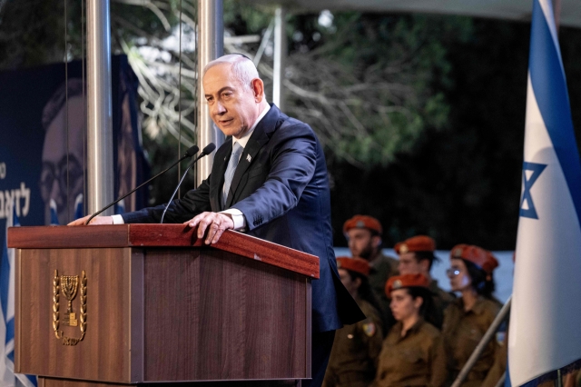 Israeli Prime Minister Benjamin Netanyahu speaks at the state memorial for Zeev Jabotinsky, Zionist leader and founder of the Israeli right-wing ideology, at Mount Herzl Military Cemetery in Jerusalem, on Sunday. (Pool Photo via AFP)