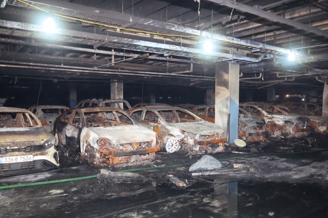 This photo shows the cars ravaged in a fire that started from an electric Mercedes-Benz sedan parked in the underground garage of an apartment building in Incheon, Aug. 1. (Yonhap)