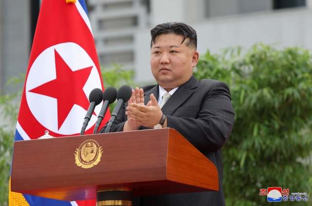 A ceremony for a youth vanguard's departure takes place in Pyongyang on Tuesday, with North Korean leader Kim Jong-un at the podium, in this photo provided by the North's official Korean Central News Agency. Kim designated the Paektusan Hero Youth Shock Brigade to undertake rehabilitation and reconstruction projects in the flood-hit city of Sinuiju and Uiju County in North Pyongan Province. (For Use Only in the Republic of Korea. No Redistribution) (Yonhap)