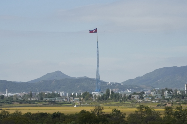 A North Korean flag waves in the wind near the border villages of Panmunjom in Paju, South Korea on Oct. 4, 2022. (File Photo - AP)