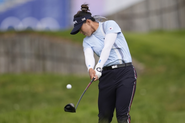 South Korea's Amy Yang hits her shot from the second tee during the third round of the women's golf event at the 2024 Summer Olympics at Le Golf National, in Saint-Quentin-en-Yvelines, France, on Friday, local time. (AP-Yonhap)