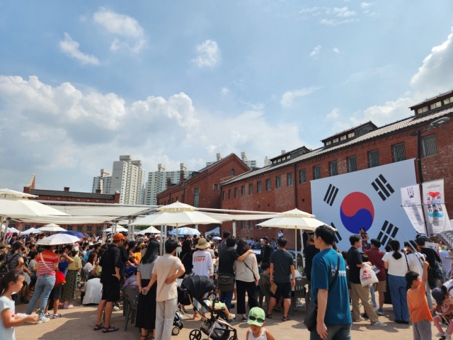 Visitors stand near Prison Building No. 12 at Seodaemun Prison History Hall in Seodaemun-gu, northwestern Seoul, Aug. 15, 2023. (Seodaemun Prison History Hall)