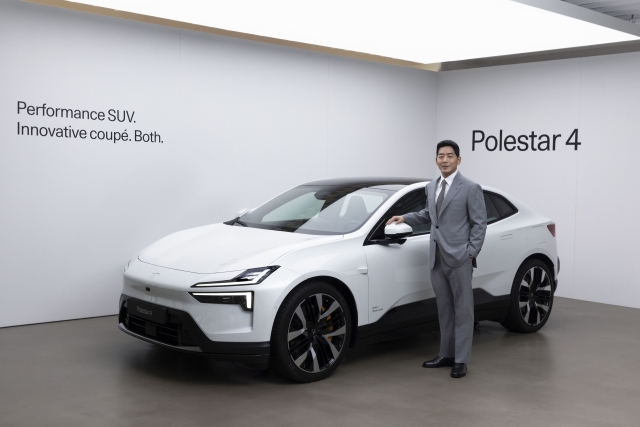 Ham Jong-sung, managing director of Polestar Korea, poses with the Polestar 4 during the electric vehicle's launch ceremony held at Polestar Space in Seoul, Tuesday. (Polestar Korea)