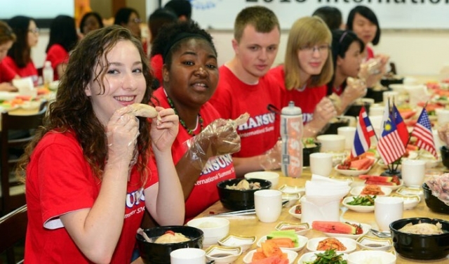 This file photo shows a group of foreign students having samgyetang in Seoul. (Korea.net)