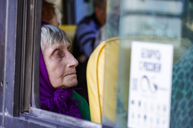 Civilians, evacuated from the Kursk Region border, sit on a bus as they arrive to the railway station in Kursk, Russia, Saturday. (AFP)