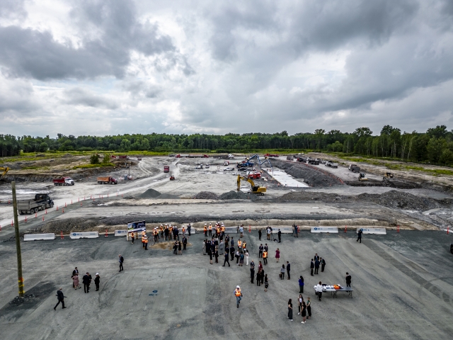 Dignitaries and construction personnel gather for the groundbreaking ceremony of the $880 million cathode manufacturing facility in Quebec, a collaborative investment by Ford, EcoProBM, and SK On, on Aug. 17 last year. (Ford)