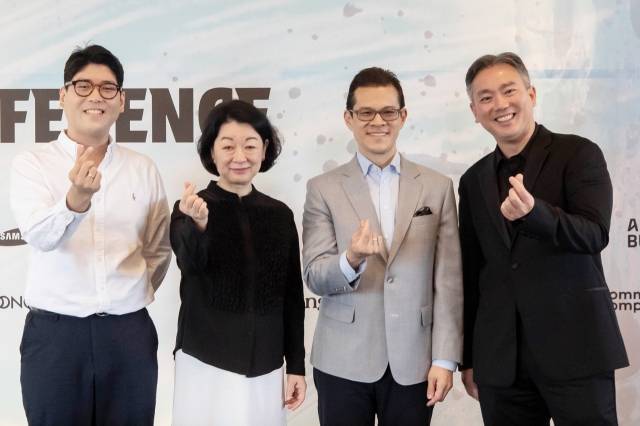 (From left) Violinist Daniel Cho, Sejong Soloists General Manager Kang Kyung-won, and violinists David Chen and Frank Huang pose for photos during a press conference on Wednesday at The Plaza in Seoul. (Sejong Soloists)