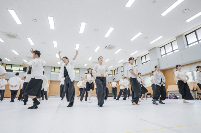 Dancers rehearse a scene from 